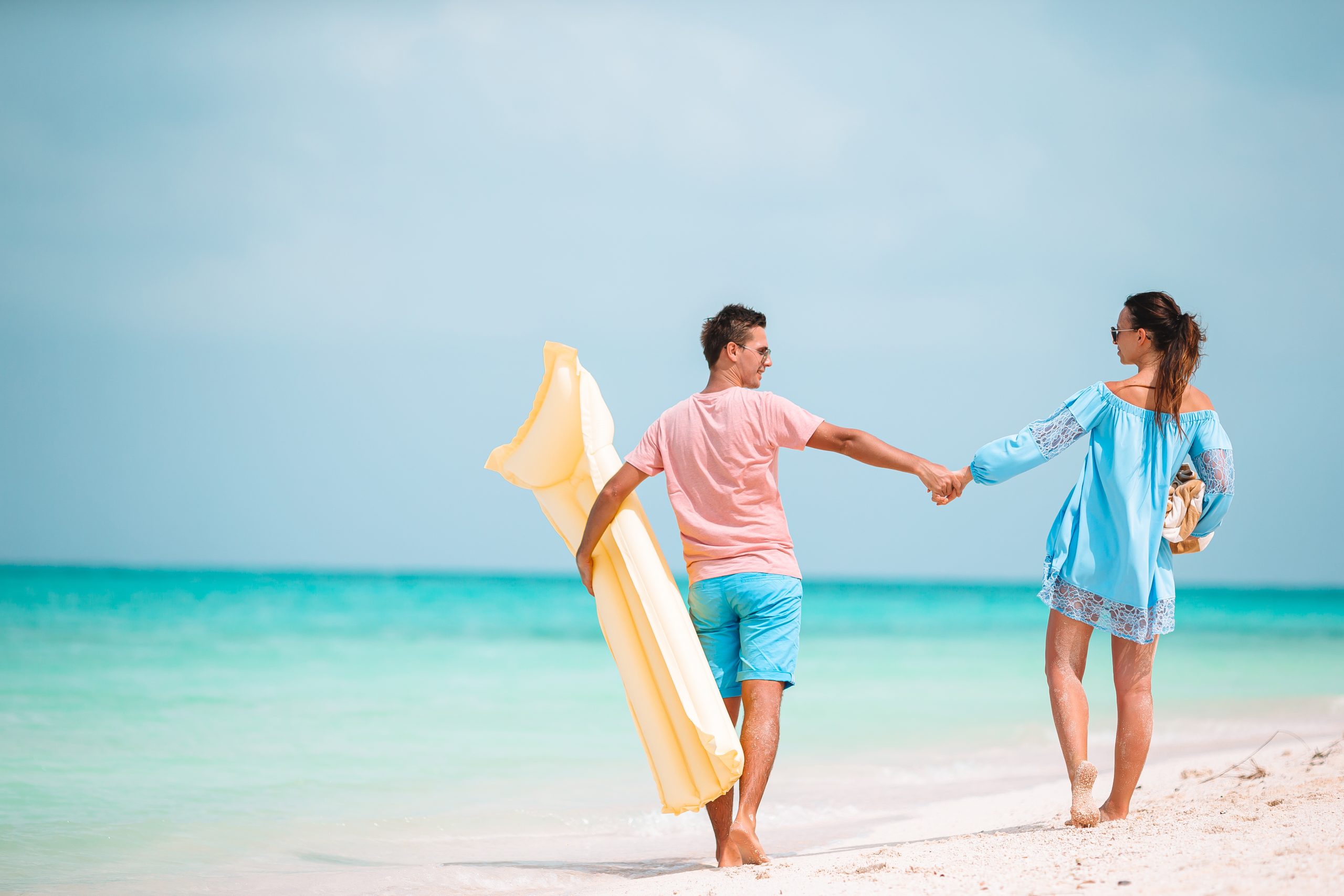 Young happy couple have fun on summer tropical vacation
